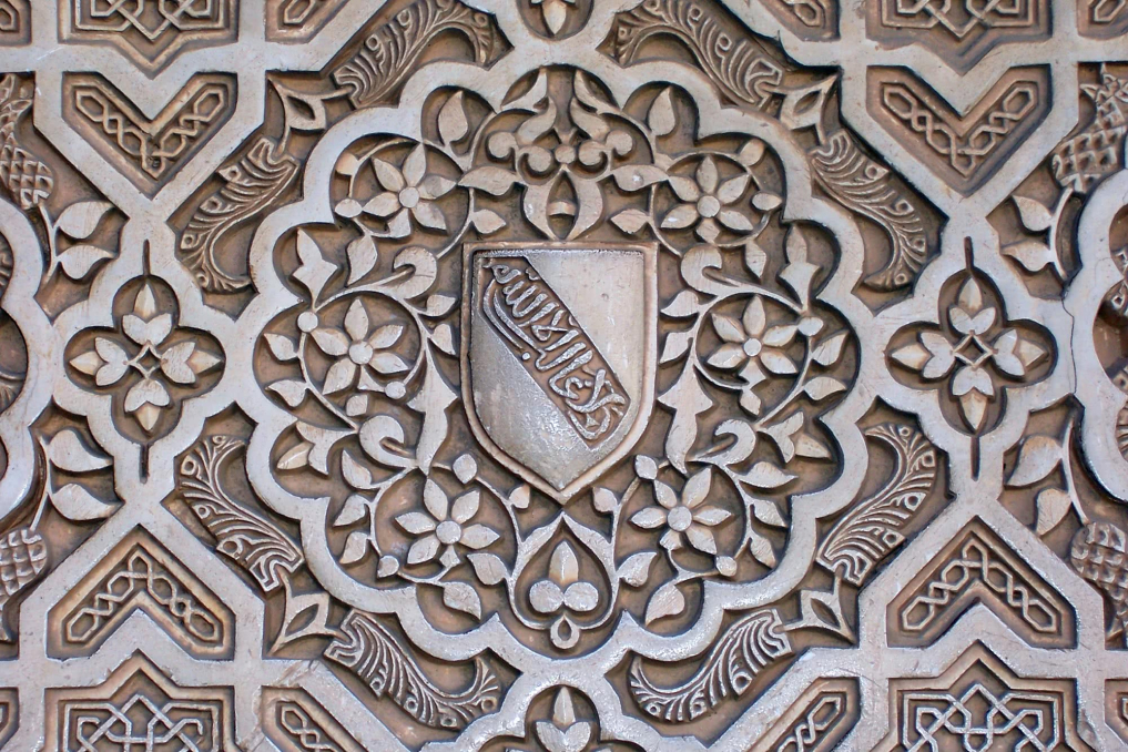 A detail shot of a wall embellished with quatrefoils in The Alhambra, in Granada, Spain. A detail shot of a wall embellished with quatrefoils in The Alhambra, in Granada, Spain.