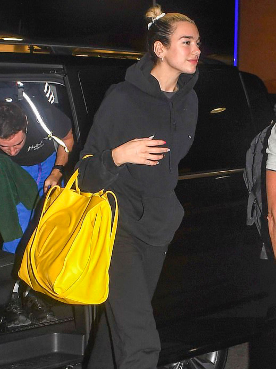 Dua Lipa with a large yellow Telfar bag Dua Lipa with a large yellow Telfar bag
